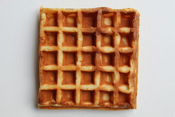 Close up texture of plain waffle, burnt side, square patterned, flat lay or top view