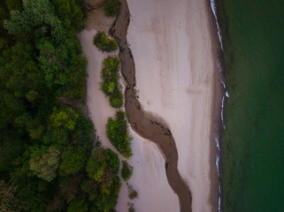 Top view of the beach in Sopot with a river flowing into the sea. Poland