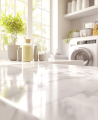 A close-up of a marble countertop in a bright laundry room, with a washing machine in the background and natural light streaming through large windows. 