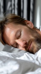 Relaxed man sleeping peacefully in bed (2)