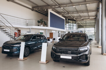 New suv cars parked in modern showroom