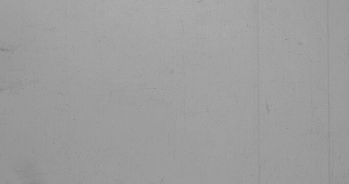 Grey Film grain seamless loop texture. Retro template backdrop for text. Old fashion tape looped animation in 4K. Vintage film effects