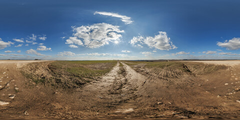 hdri 360 panorama view on gravel muddy road among fields at evening with flock of birds in clouds in equirectangular full seamless spherical projection, ready for VR AR or sky dome replacement