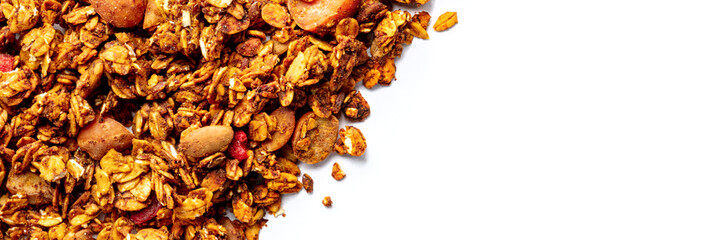Granola panorama on a white background, with copy space. Organic gourmet muesli, top shot