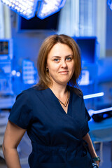 Surgeon in modern operating room setting. A medical professional poses confidently in a modern...