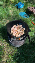 Pilaf with meat, the process of preparing the culinary dish pilaf in a cast iron frying pan over a...