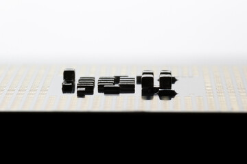 Close-Up of Electronic Circuit Components on a Microchip Surface