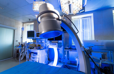 Surgical room's advanced tools. A modern surgical room featuring high-tech medical equipment,...