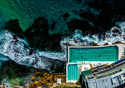 Aerial view of ocean pool and waves at coastline at Sidney
