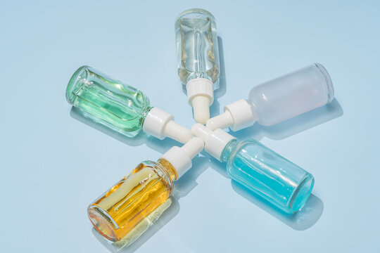 Colorful serum bottles arranged in circular formation