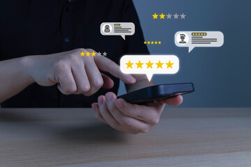 Hotel and Restaurant Review. person choosing five star button to review good rating for hotel on mobile phone, satisfaction, customer review, digital marketing, good experience, product review concept