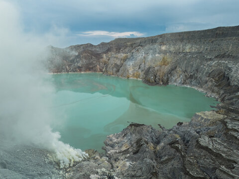 Crater Lake and Sulfur Gas at Ijen Volcano in East Java, Indonesia - Powered by Adobe