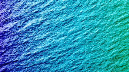 A close up of a grainy blue concrete studio wall . Blue textured plaster background with vignette effect for design projects Grungy abstract backdrop with ample copy space image