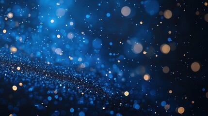 Obraz premium Blurred bokeh lights sparkle in a dark blue and gold abstract texture. Ideal for backgrounds, holiday themes, and adding magical elements.