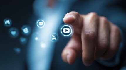 Hand touches a digital play button surrounded by social media icons.