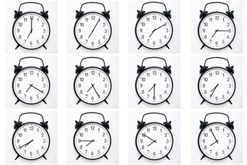 A set of 12 Black Vintage Alarm Clocks showing time from 07:00 to 07:55 or 19:00 to 19:55. Isolated...