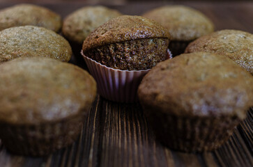 Homemade Chocolate Chip Muffins on a Wooden Table