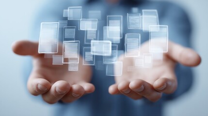 Hands present floating square icons representing technology or data in a bright setting.