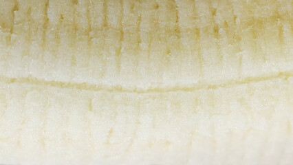 Close-up of fresh, peeled banana with visible pulp structure details