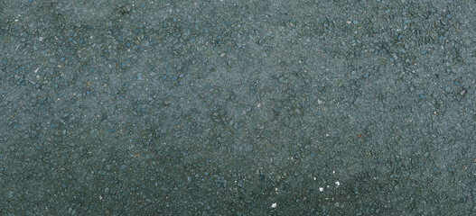 Detailed texture of dark asphalt roadway surface for urban infrastructure