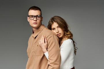 Elegant couple shares a loving embrace in a romantic portrait capturing timeless beauty