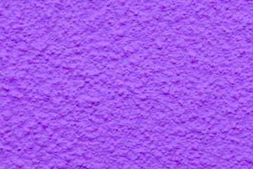 Purple concrete wall texture background. Rough and grunge texture. Stucco cement wall background.