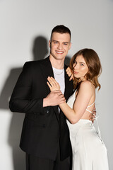 Celebrating love in elegance as a beautiful couple embraces their special moment together