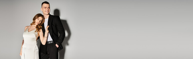 Elegant young couple celebrates their love in a timeless moment of romance and joy