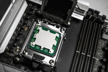 A central processing unit is securely seated in a motherboard socket, ready for the retention...