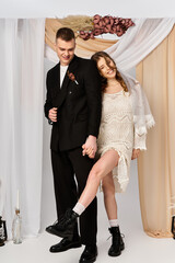 Celebrating love and elegance with a joyful bride and groom in unique wedding attire