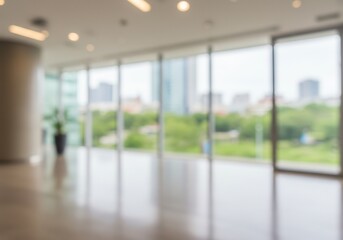 Fototapeta premium Blurred interior of a modern office building with city view through windows