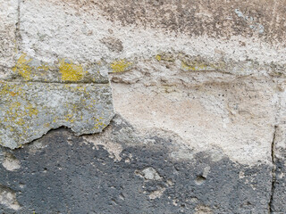 Weathered stone wall texture with cracked cement details