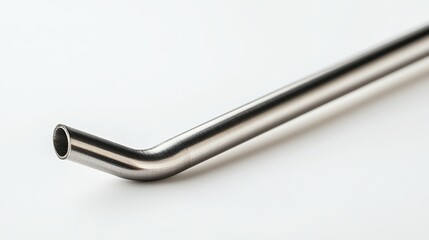 Stainless steel straw or tube displayed as an eco-friendly metal pipe alternative, isolated on a white background in a macro view