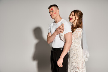 Elegant couple celebrating love in stylish attire showcasing romance and joy in a modern setting