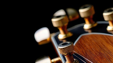 Detailed shot of the guitar headstock with tuning pegs and wood texture in sharp focus