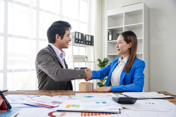 Business Agreement Handshake in Office