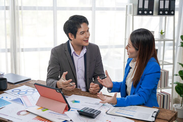 Business Colleagues Discussing Financial Data in Office