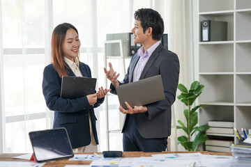 Business Colleagues Discussing Project in Office