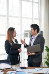 Business Colleagues Discussing Work in Office