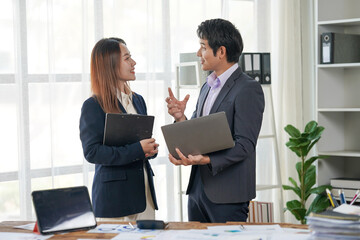 Business Professionals Discussing Project in Office