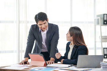 Business Colleagues Discussing Project in Office