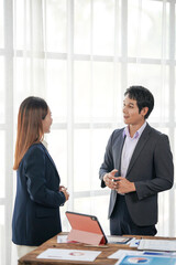 Business Professionals Discussing Data Analytics in Office