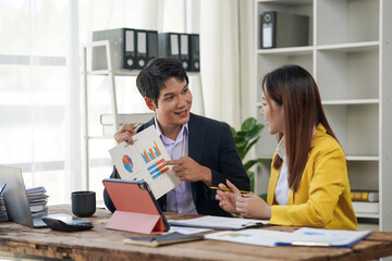Business Professionals Discussing Charts and Graphs