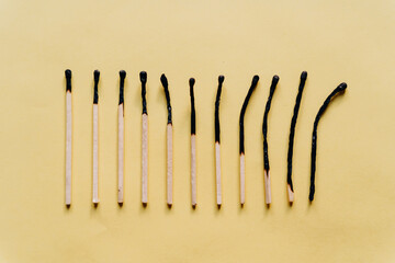 Conceptual image series using matches &mdash; new, burned, and burning &mdash; to represent stages of burnout, emotional fatigue, and mental exhaustion