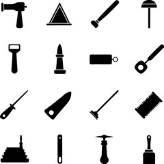 Black silhouettes tools and objects arrayed on white background