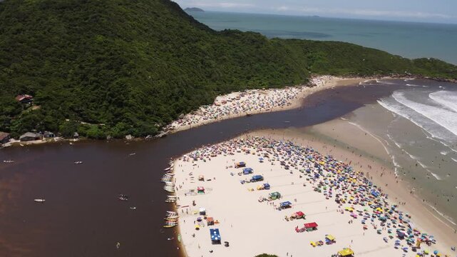 4K Drone Push Forward Over Beach and River at Guarda do Emba&uacute;, Brazil