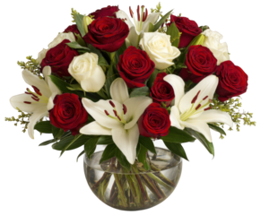 Beautiful floral arrangement featuring vibrant red roses and elegant white lilies, artfully arranged clear glass vase. This stunning bouquet is perfect for any occasion, radiating joy and elegance