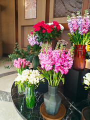 Vibrant flower display in a modern indoor setting showcases diverse blooms and elegant arrangements