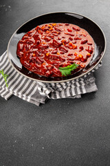 Chile con carne plate beans, tomato, corn, meat fresh delicious gourmet food background on the table rustic food top view copy space