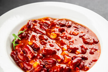 Chile con carne plate beans, tomato, corn, meat fresh delicious gourmet food background on the table rustic food top view copy space